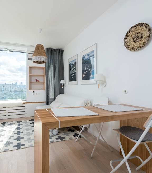 A room with a desk and a chair in it.
