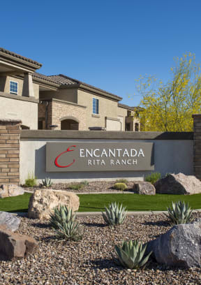 a view of the sign at the entrance to the encantada saguaro national park