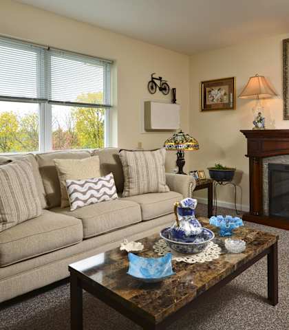 a living room with a couch and a fireplace