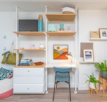 a home office with a desk and a chair in a living room at The Teale, Kissimmee, FL, 34746