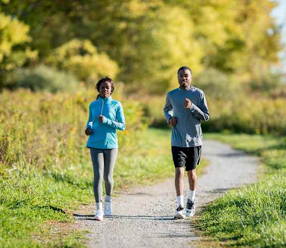 a man and a woman running on a trail at Overland Gardens, Maryland, 20785