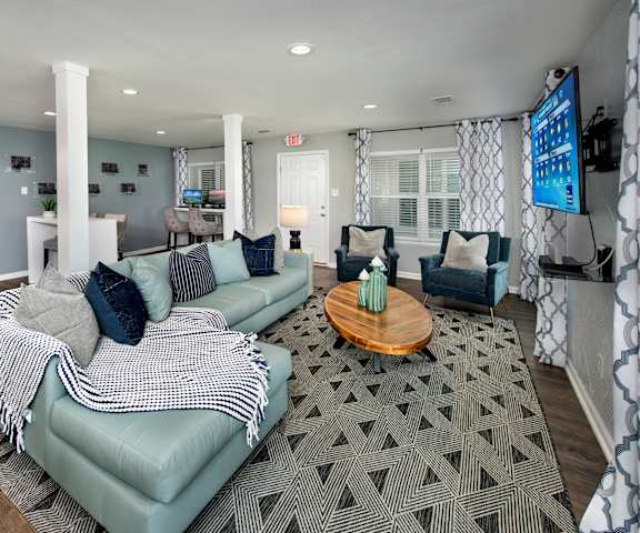 a living room with couches and a coffee table