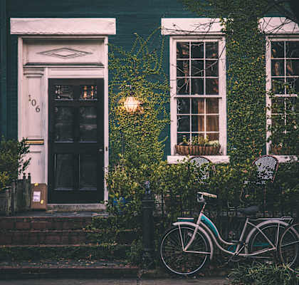 a bike parked in front of a house
