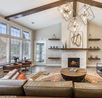 a living room with a fireplace and couches at Brittany Commons Apartments, Spotsylvania, VA, 22553