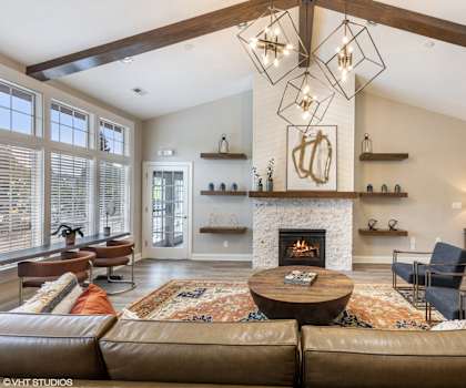 a living room with a fireplace and couches
