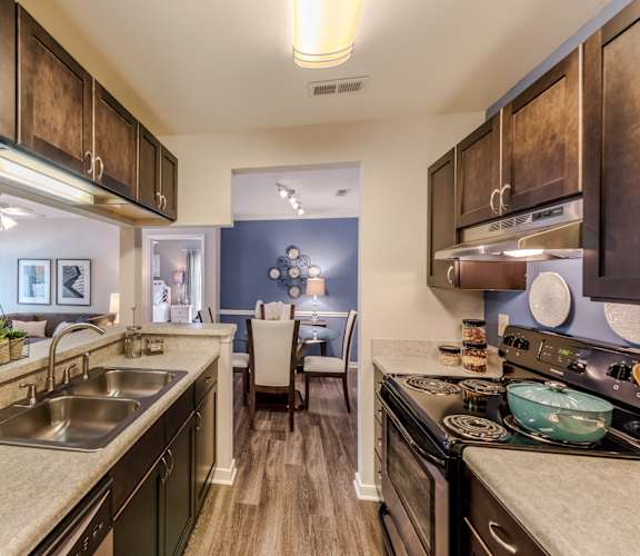 an open kitchen and living room with a dining area and a living room at Brittany Commons Apartments, Spotsylvania, VA, 22553