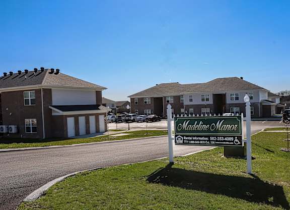 a welcome sign in front of a house
