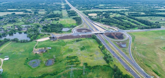 an aerial view of a highway intersection with highways and bridges