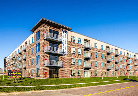 A large apartment building with a sign that says "BROOKLYN".