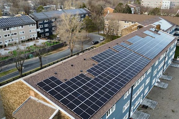 A building with solar panels on the roof.
