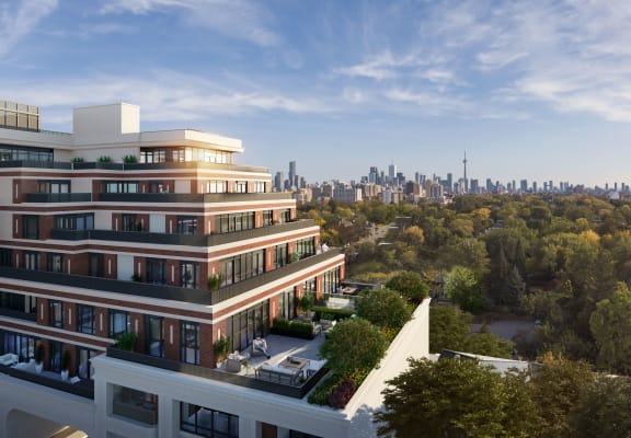 Empire Maven facade with oversized terrace overlooking city skyline and green trees