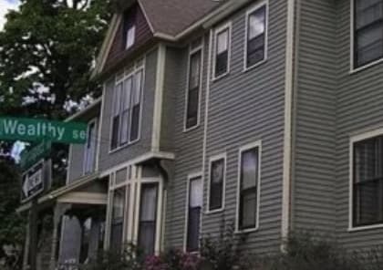 a house with a street sign in front of it