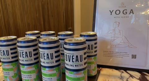 the line up of yoga cans in front of a yoga poster