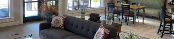 a living room with a couch and a table
