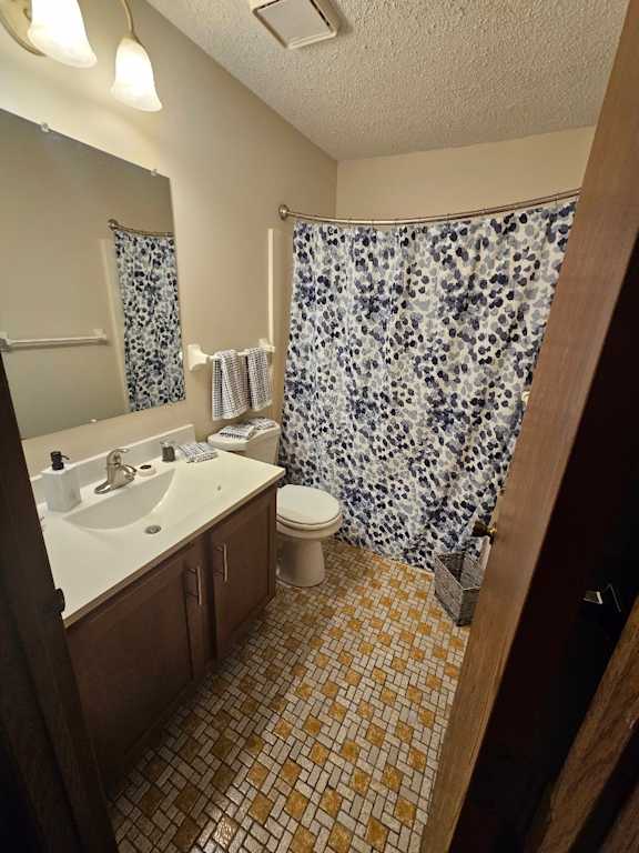 A bathroom with a leopard print shower curtain.