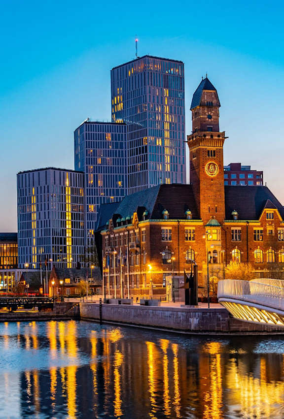 a cityscape with a large clock tower