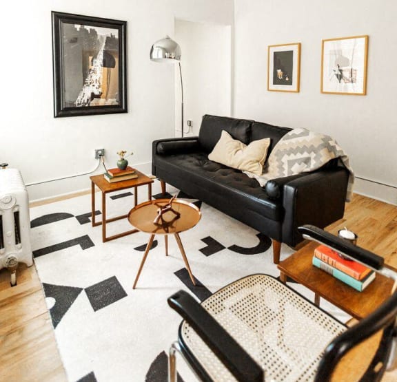 a bedroom with a bed and bookshelves     and a chair