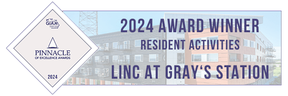 A building with a sign that says "Pinnacle of Excellence Awards 2024 Award Winner Resident Activities LINC at Gray's Station".