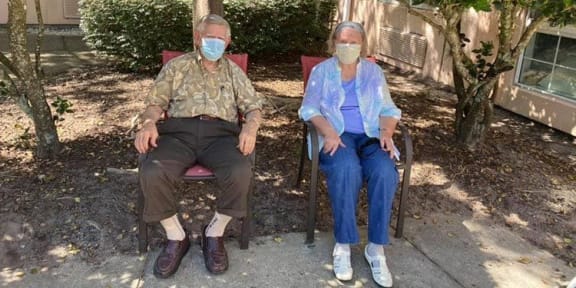 Senior Couple Sitting at Savannah Court of Maitland, FL, 32751