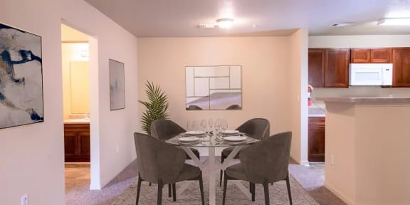 a dining room with a table and chairs