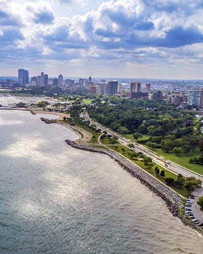 a view of the city from above the water with a city skyline  at Prospect East Apartments, Milwaukee