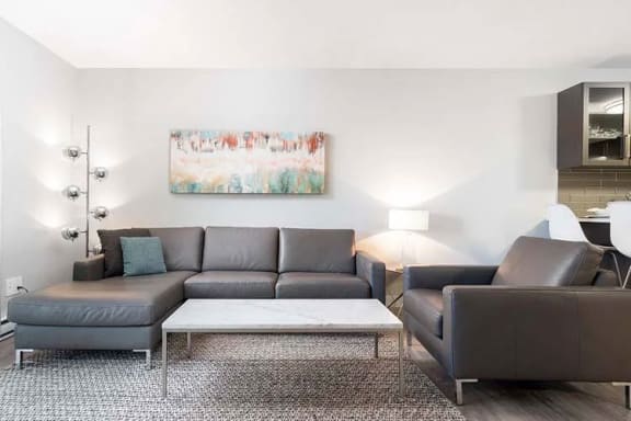 a living room with a couch and a chair