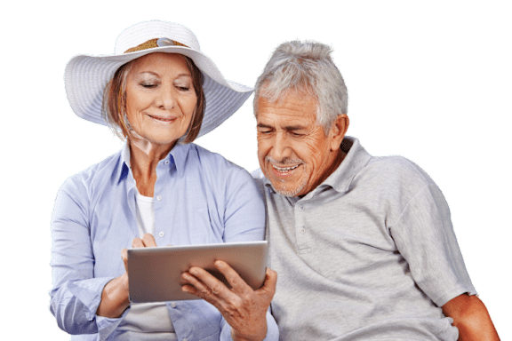An older couple is looking at a tablet together.