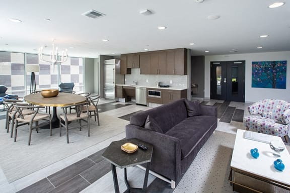 a living room and dining room with a couch and a table