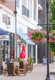 A storefront with awnings and a sign that says Vineyard Vines.