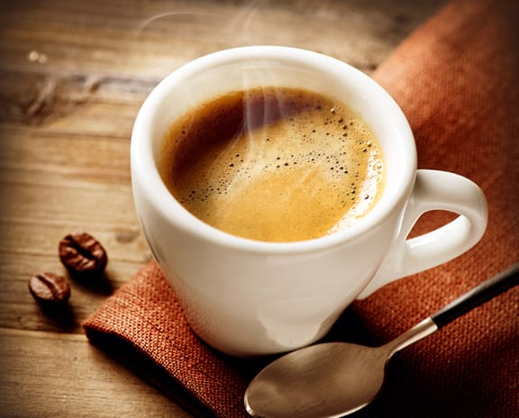 a cup of coffee on a table