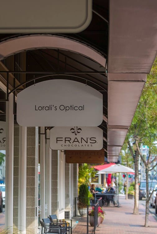 a view of the front of the lorillard optical store from the sidewalk