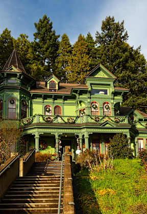 a building with many balconies and people walking on it