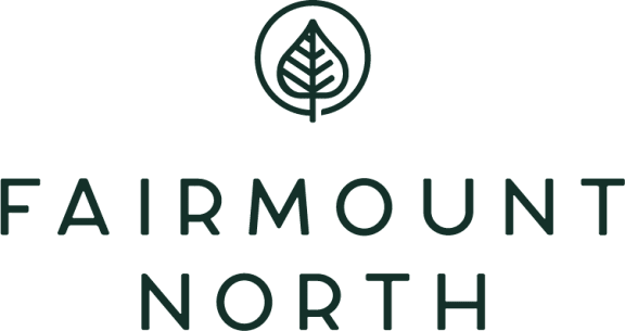 A logo with a leaf and the words "Fairmount North" in black text on a white background.