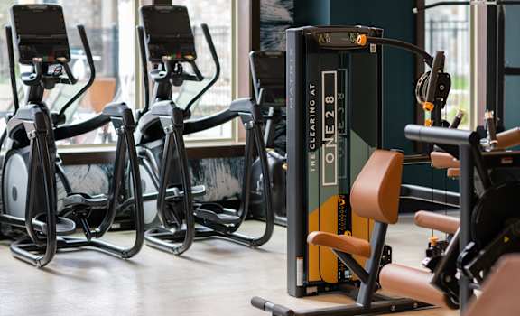 a row of exercise bikes in a gym  at The Clearing at ONE28, Olathe, Kansas