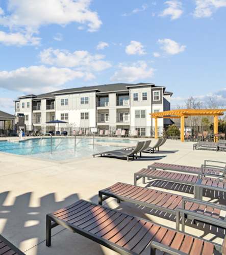 Pool area with lounge chairs at our Indian Land apartments.