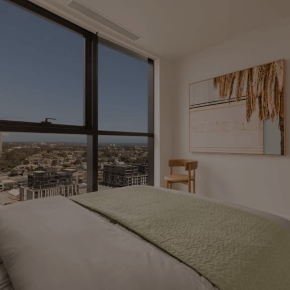 a living room with furniture in front of a building