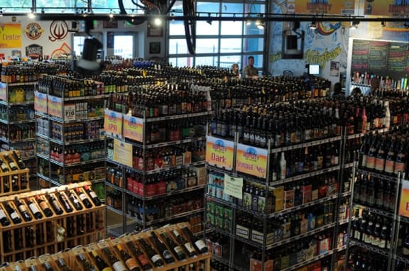 a store filled with lots of bottles of beer