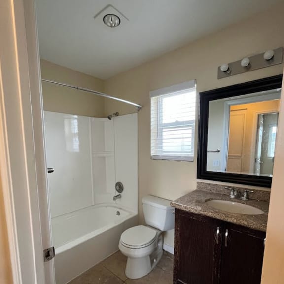a bathroom with a toilet sink and bathtub