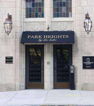The front of a building with a sign that says Park Heights.