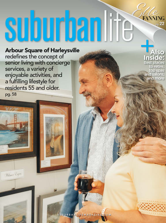 A magazine cover with a man and woman standing close together.
