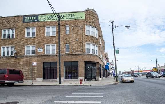 a brick building on the corner of a city street