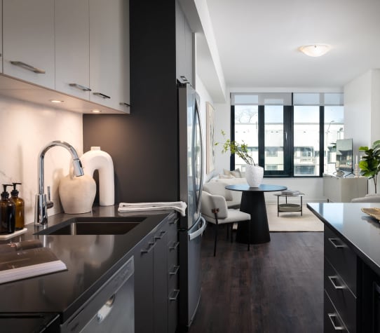 a kitchen and living room in an apartment