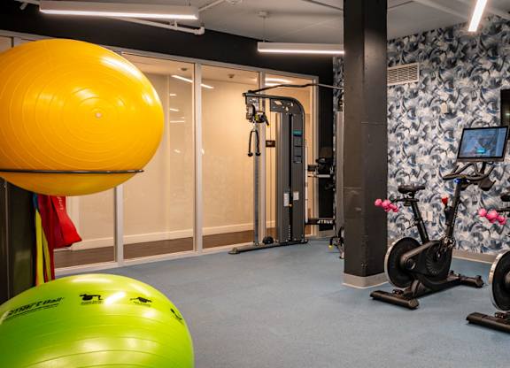 Fitness center with bikes and cable machine at Union 346, Massachusetts, 02143