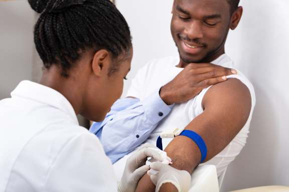 A healthcare professional is giving an injection to a patient.
