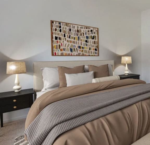 a bedroom with a bed and a painting on the wall
