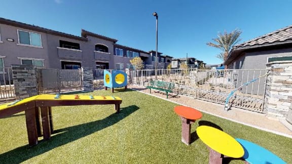 a childrens play area with a table and chairs