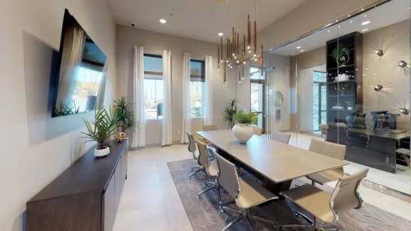 a dining room with a wooden table and chairs