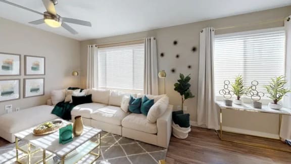 a living room with a white couch and a table