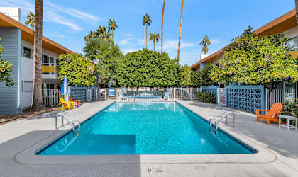 A rectangular pool with a diving board in the middle at The Phoenix Apartments on 6th Avenue, Phoenix
