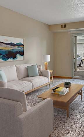 a living room with a white couch and a coffee table